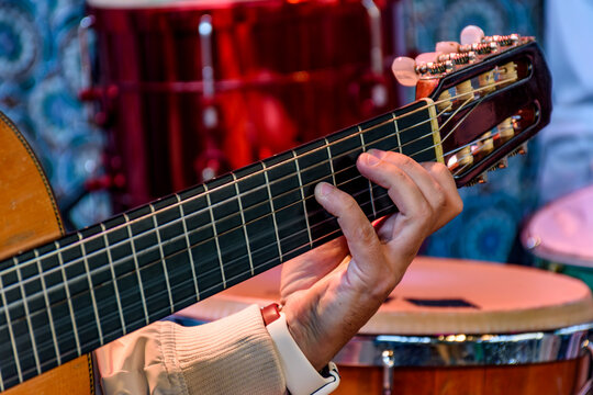 Acoustic guitar player in stage during brazilian popular music presentation
