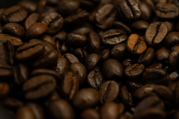 A macro shot of roasted coffee beans showcasing their texture and rich brown color