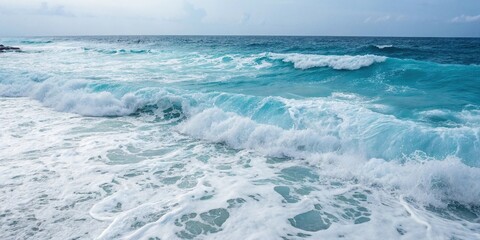 Fototapeta premium White foam and blue waters blend together in a mesmerizing dance on the ocean surface, white, energy, water