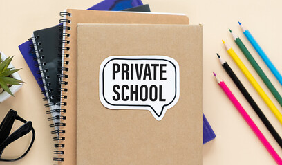 Private School, A golden with grad cap piggy bank, card and calculator on a wood background with text Private School