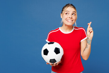 Young woman fan wear basic red t-shirt cheer up support football sport team hold in hand soccer...