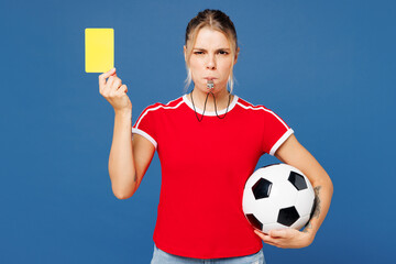 Young woman fan wear basic t-shirt cheer up support football sport team hold soccer ball, yellow...