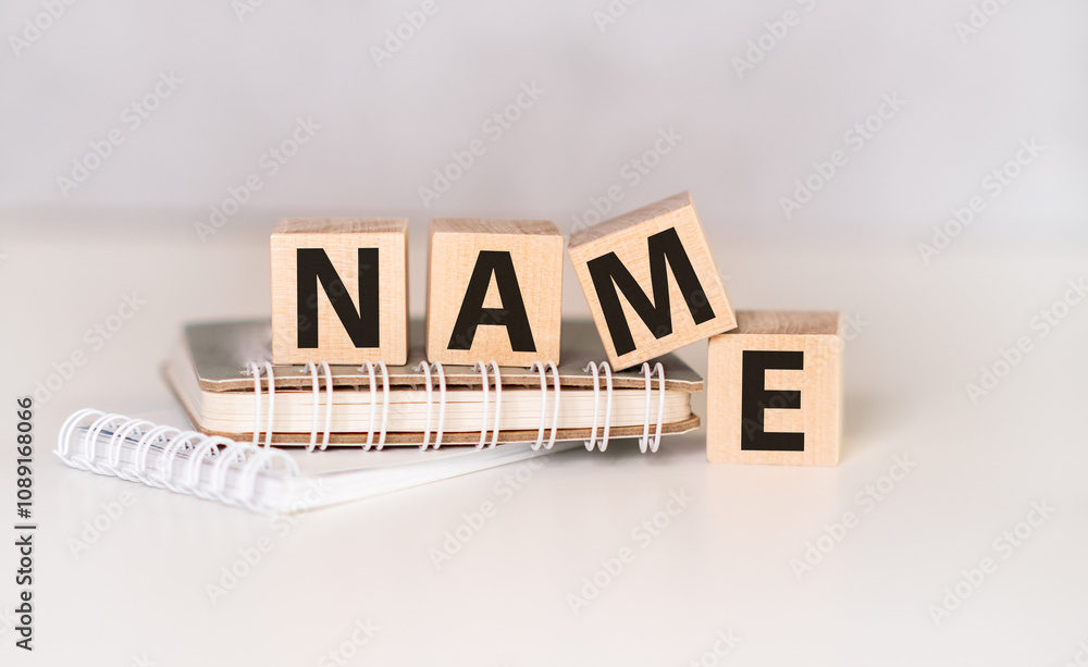 Poster text name written on wooden cubes on the back also cubes