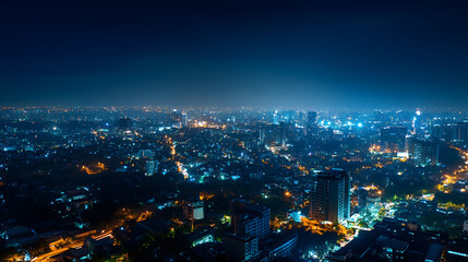 Fototapeta premium Aerial view of vibrant night cityscape with blue lighting and urban life