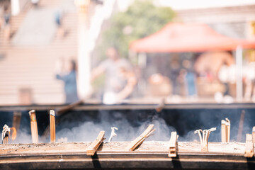 Incense burning with ashes in the Jingan Temple in the center of Shanghai, China
