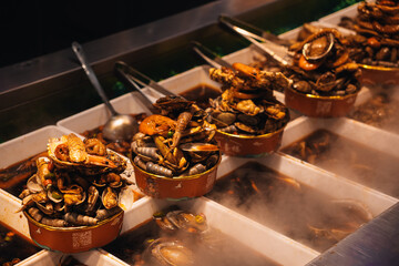 Chinese seafood in street marketChinese seafood box displayed in a popular street market in Nanjing Road at night
