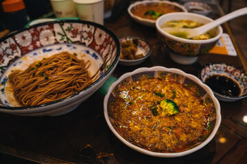 Crab meat noodles soup, a very popular dish in Shanghai where it is common that the workers of the restaurant peal the crab meat in front of the customers; China