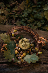 symboling moon amulet, acorns, oak leaves and wreath of branches outdoor, nature abstract...
