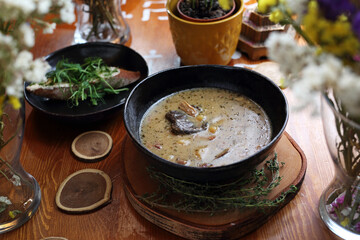 Zalewajka, zurek, sour rye soup, traditional country Polish soup with potatoes, homemade sourdough, bay boletes, thyme.