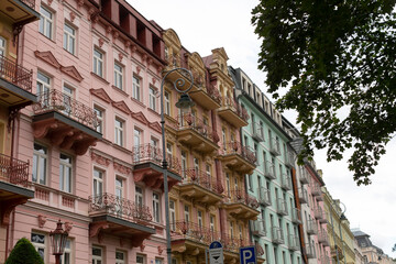 The colorful and vibrant facades of historic apartments beautifully showcase unique architecture, inviting balconies, and a lively cityscape that greatly enhances the overall neighborhood atmosphere