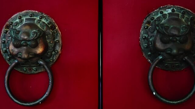Close up of ancient Chinese door handles, slow motion video