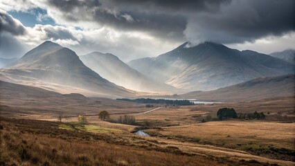 Naklejka premium Dramatic mountain vistas with mist-shrouded peaks and rolling hills in the Scottish Highlands near Bridge of Orchy, natural wonders, bridge of orchy, rugged terrain, mountain ranges