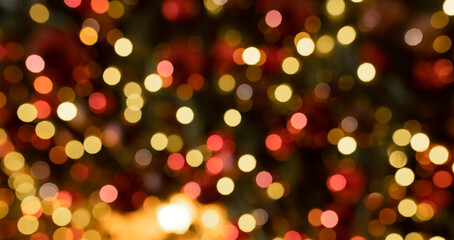 Colorful blurred lights create a festive ambiance during the holiday season in a warm indoor setting