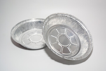 Empty disposable round aluminium food foil container isolated on a white background
