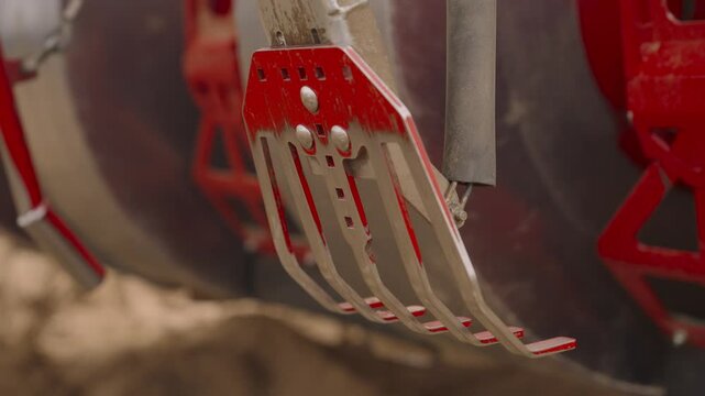Potato harvester rake. Close-up. Agricultural machinery harvesting potatoes. 
