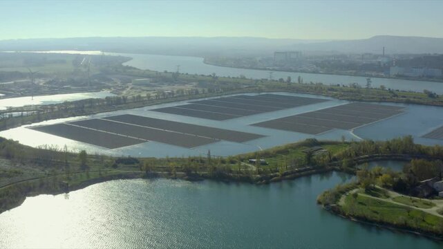 Aerial shot of the largest solar panel farm floating on a lake, Orange, France