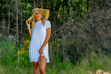 Nature's Harmony: Blonde Beauty Embraces Spring Air Amid Lush, Flower-Filled Fields