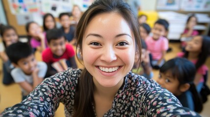 A joyful young teacher takes a selfie with a diverse group of smiling students in a vibrant, engaging classroom setting.
