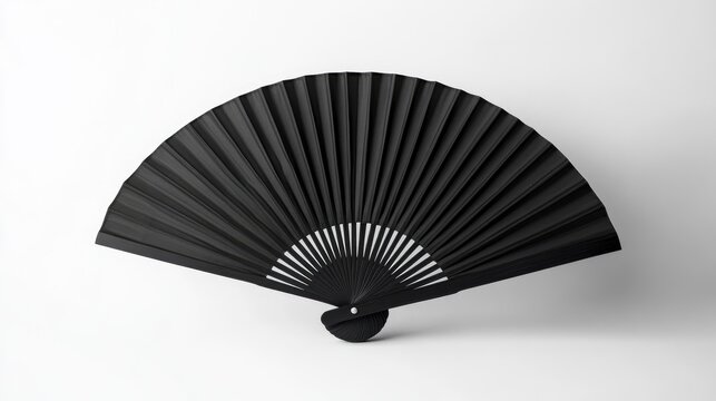 Elegant black fan displayed against a crisp white background, capturing the essence of summer and adding a touch of sophistication to any decor.
