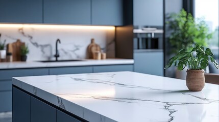 Modern kitchen featuring a pristine white marble tabletop with elegant veining, soft blue hues, and a serene blurred background of greenery and cabinetry.