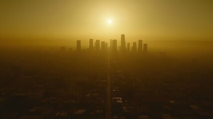 Hazy sunset over a city skyline.