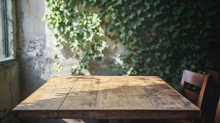 Cozy wooden table blending indoor and outdoor charm in a cafe, with a backdrop of lush ivy-covered wall creating a warm atmosphere