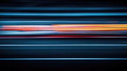 Motion blur effect of a racetrack with streaks of colored lights at the start and finish line during early morning hours