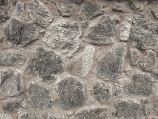 Brown and gray stone wall pattern. Premium rock wall textures. Stone dark color. Seamless rock wall textures. Stone plate paving seamless pattern. Brown, grey and white grunge texture. illustration.