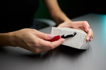 Unboxing a Mysterious Package Using a Craft Knife for an Exciting Experience and Surprise