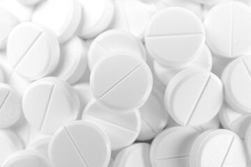 Pile of antibiotic pills as background, closeup