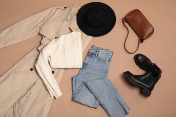 Stylish clothes, shoes and accessories on beige background, flat lay