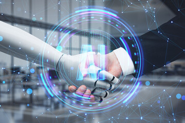 Close up of man and robot handshake on blurry office interior background. Machine learning, ai and...