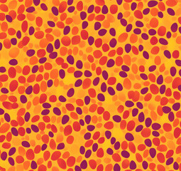 Abstract seamless pattern with orange, red, and purple pebbles on a yellow background.