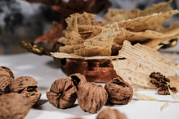 Tarhana cips, crispy snacks a traditional turkish anatolian fermented soup base made into crunchy chips made of youghurt and cereals, served with walnuts