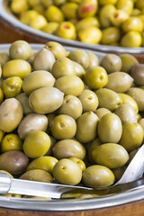 Fresh green olives in barrels. Traditional Greek addition to dishes