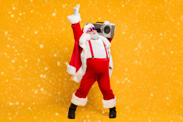 Full size photo of funny overweight christmas white beard hair grandfather hold retro boombox show...