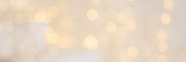Christmas Background. Golden Holiday Abstract Glitter Defocused Background With Blinking Stars. Blurred Bokeh . Banner with copy space.