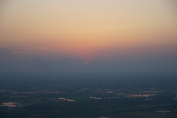 Sunset over serene landscape rural area nature photography peaceful atmosphere wide-angle view tranquility in nature