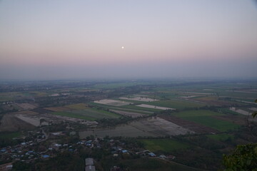Fototapeta premium Sunrise over vast fields rural landscape aerial view tranquil morning nature's beauty expansive horizon