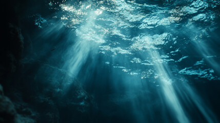 Fototapeta premium Underwater light beams illuminate a tranquil ocean scene in clear water