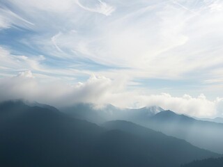Obraz premium ethereal landscape with wispy clouds and misty mountains, misty peaks, dreamy skies, atmospheric perspective