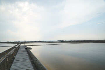 Tranquil sunrise reflections over salt flats coastal region photography serene landscape wide angle nature's beauty