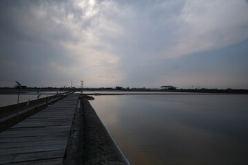 Tranquil evening reflections coastal dock landscape photography serene waters wide-angle view calmness and nature's beauty