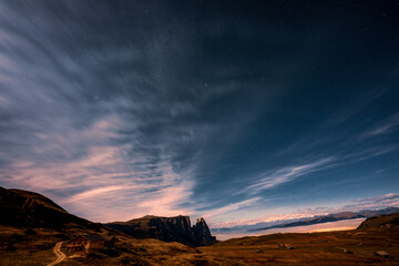 Starry sky over Seiser Alm in the Dolomites, Italy.