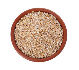 Dry wheat groats in bowl isolated on white, top view