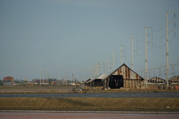 Desolate house amidst power lines rural area photography open landscape wide angle industrial...