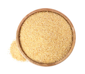 Raw wheat groats in bowl isolated on white, top view