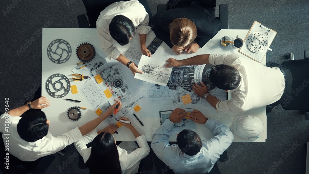 Poster top down aerial view of smart engineer team working together to design turbine engine. professional 