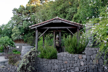 Obraz premium Ancient wine press surrounded by lush vegetation in La Esperanza, Tenerife, Spain