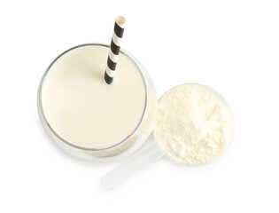 Delicious protein shake in glass and scoop with powder isolated on white, top view